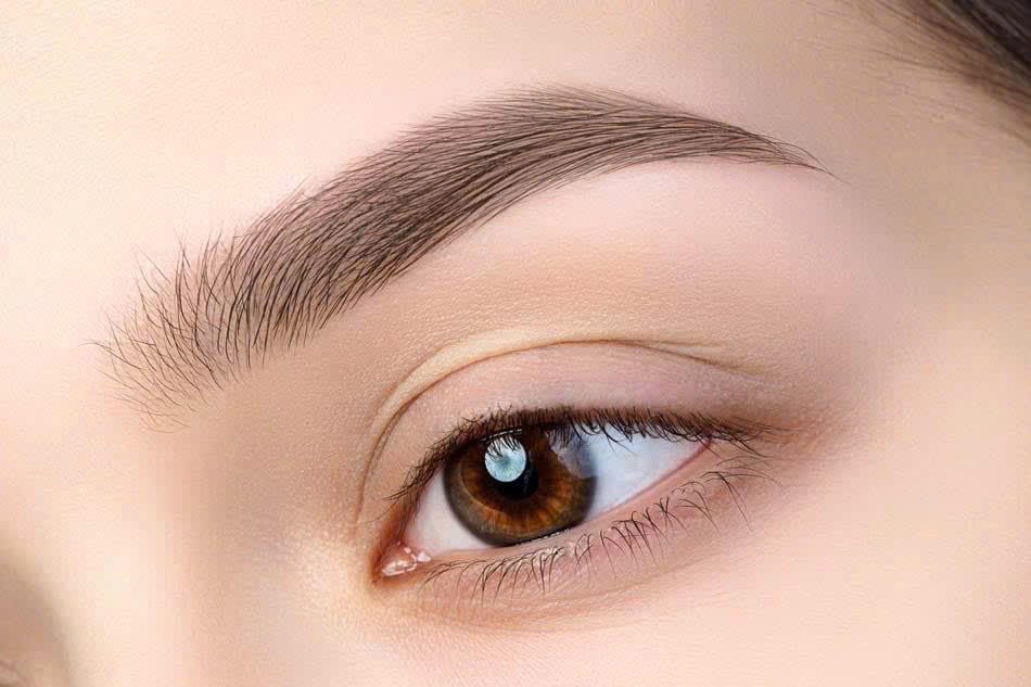 Natural brow detail after permanent makeup treatment